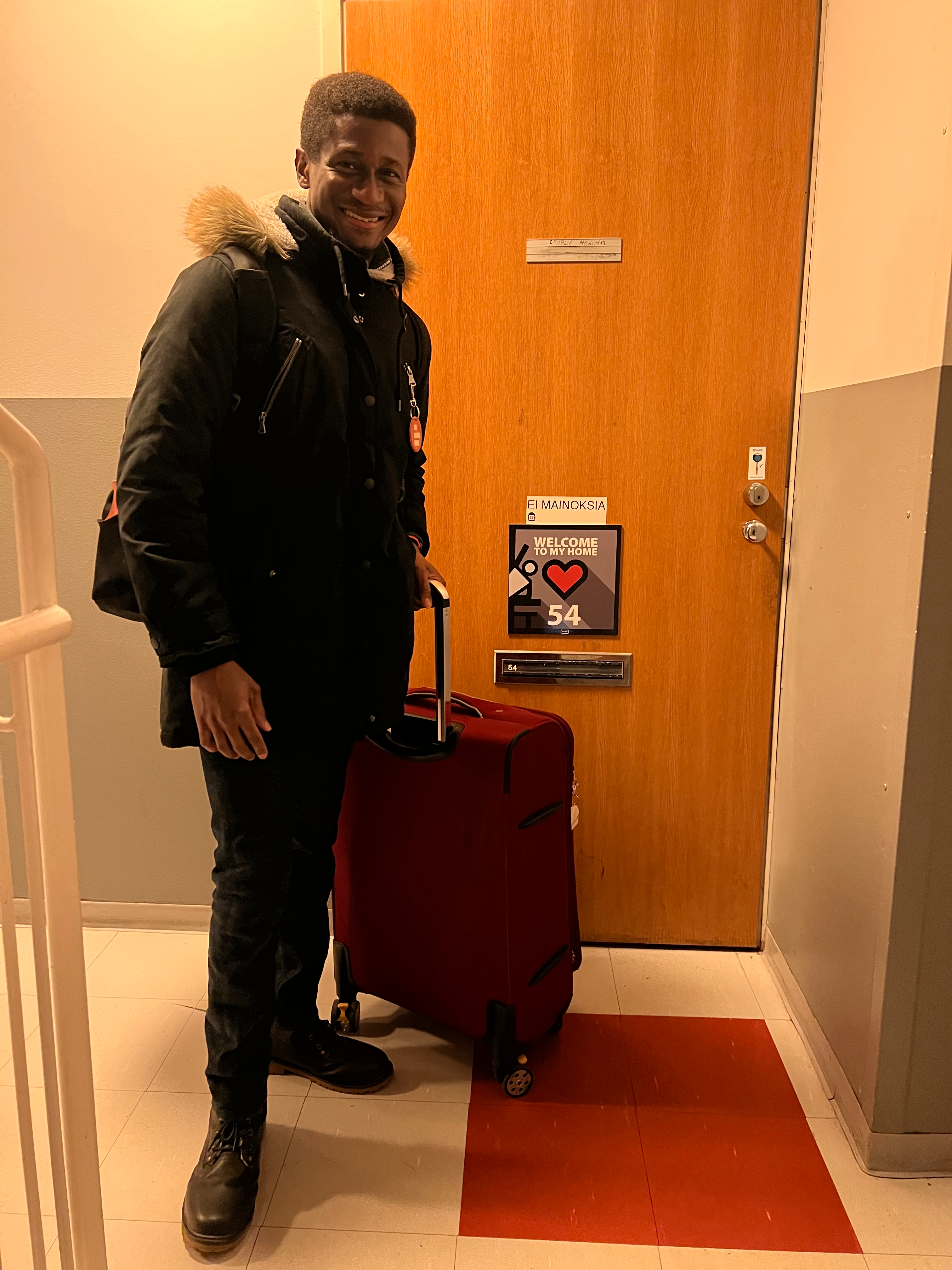 a man standing in the front of a door